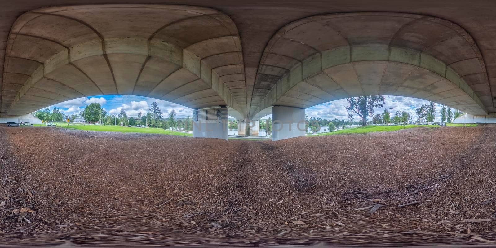 Spherical 360 panorama photograph under the bridge that spans the Nepean River in Penrith in regional New South Wales in Australia