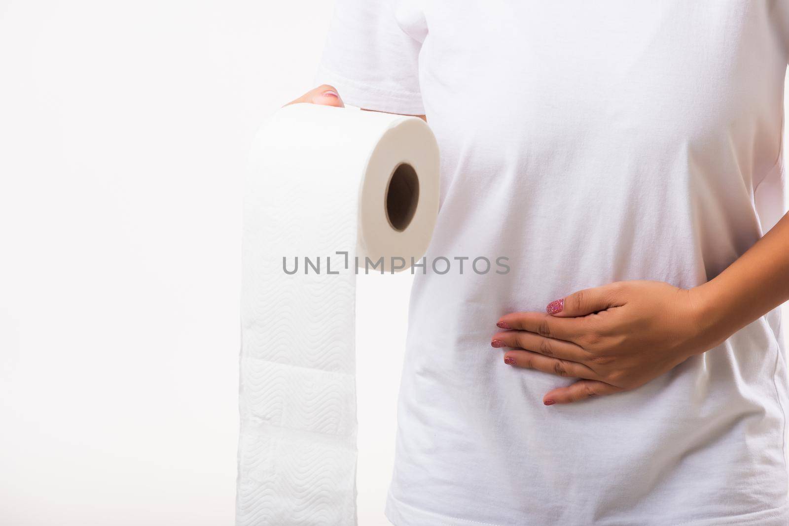 Closeup Asian young woman diarrhea constipation holding stomachache and tissue toilet paper roll on hand she crotch lower abdomen want to WC, studio shot isolated on white background, Health care