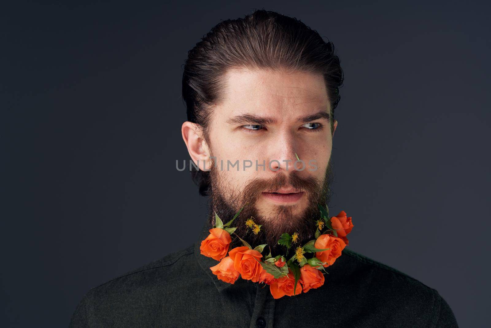 bearded man flowers decoration close-up romance black background by SHOTPRIME