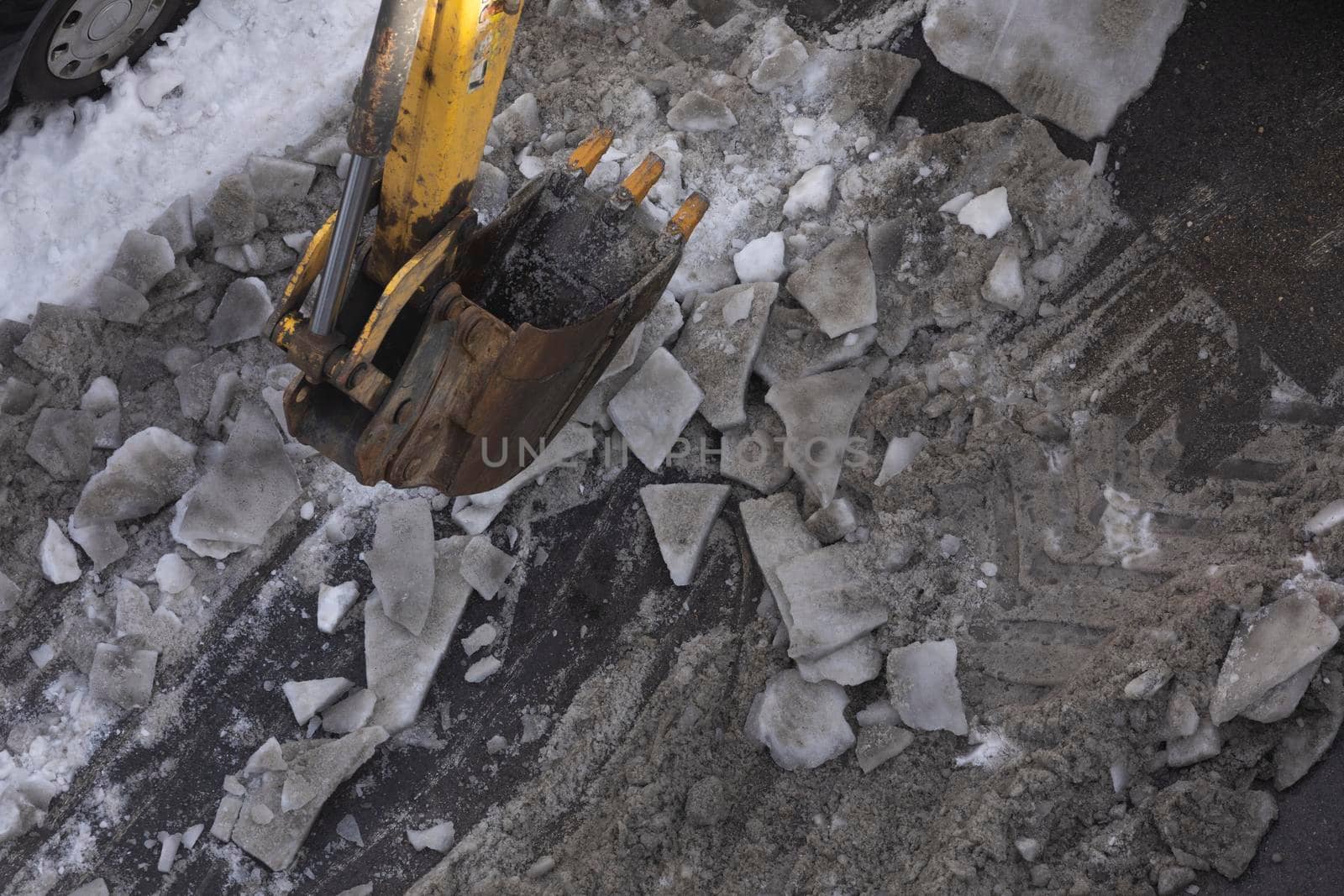 Excavator machine snow plow, working in Madrid. by alvarobueno