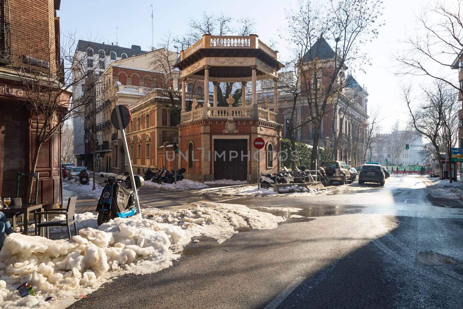 Madrid, Spain - January 17, 2021: View of Bustos de Emperadores monument in Juan Alvarez Mendizabal street, still with some accumulated and dirty snow, without removing it for days, after Filomena.