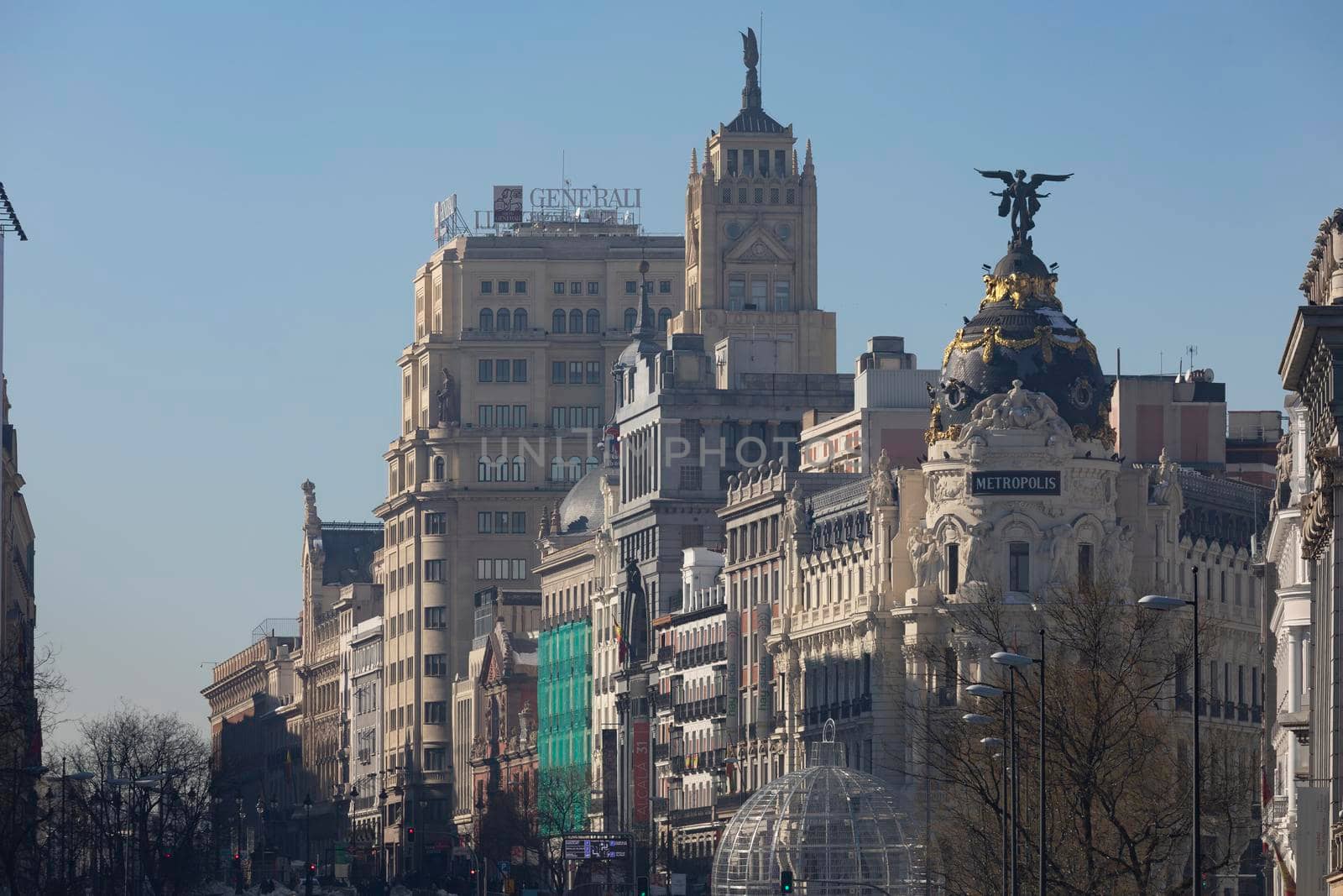 Madrid, Spain - January 17, 2021: General view of Alcala and Gran Via streets with the Metropolis building, in a cold day after Filomena.