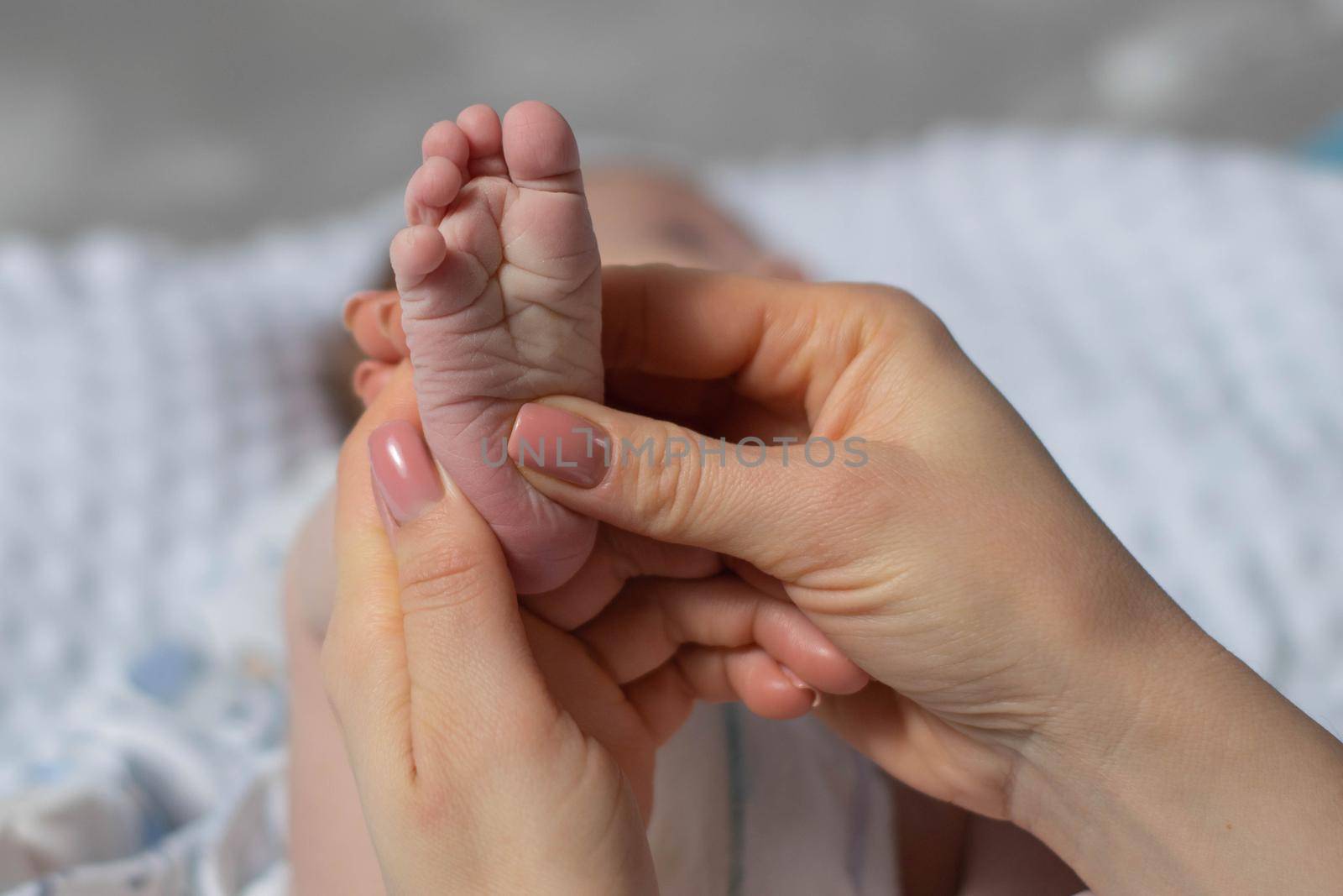 Pictures of cute baby feet. Baby feet in mother hands.