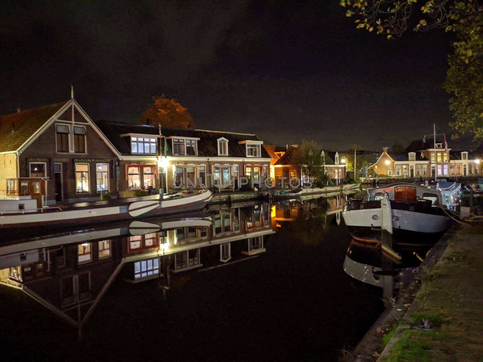 Housing along the canal at night in Sneek, Friesland, The Netherlands