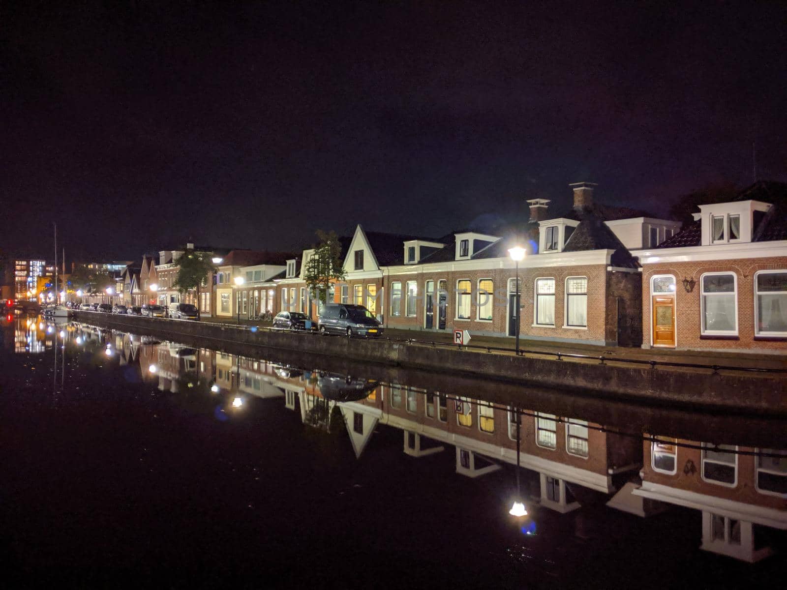 Housing along the canal at night in Sneek, Friesland, The Netherlands