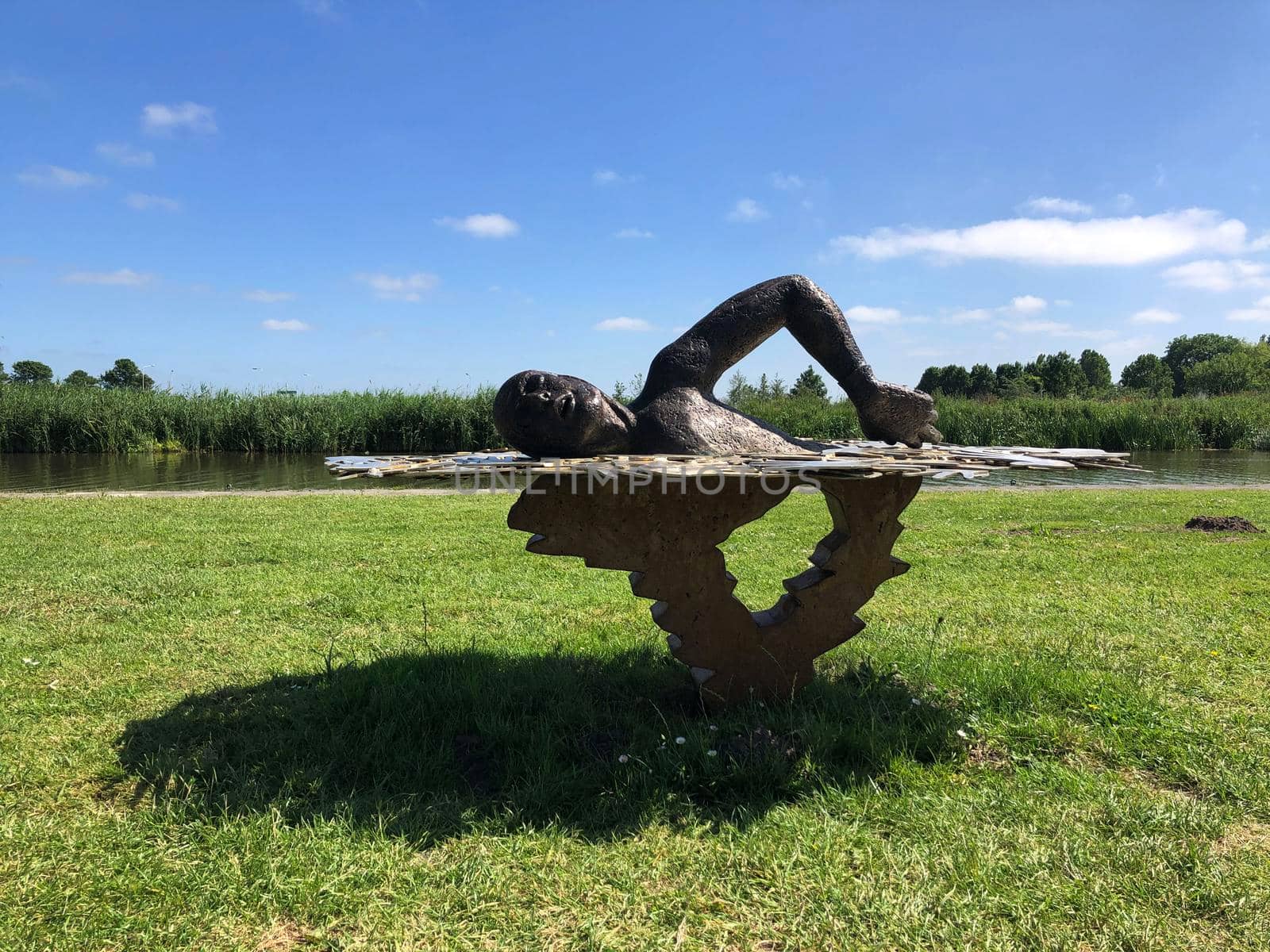 Statue from long distance and marathon swimmer Maarten van der Weijden in Burdaard, Friesland, The Netherlands