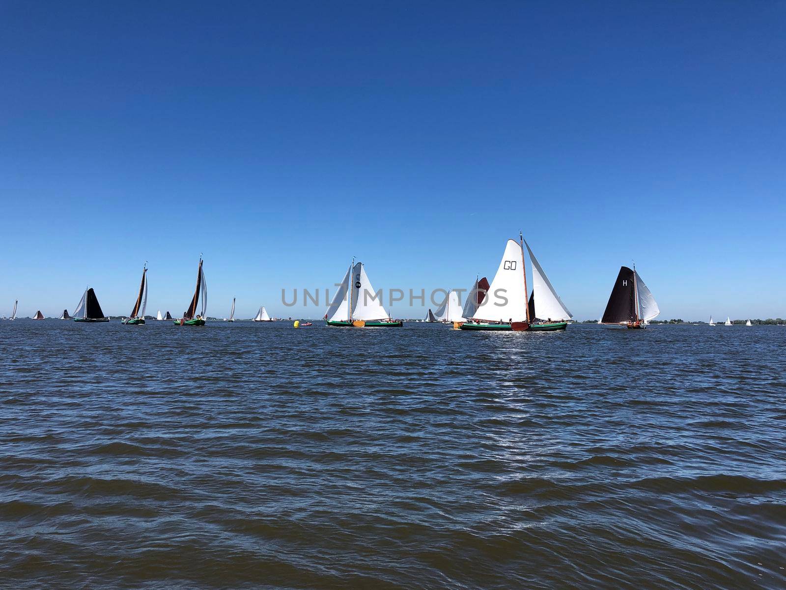 Sailing on a lake in Friesland The Netherlands