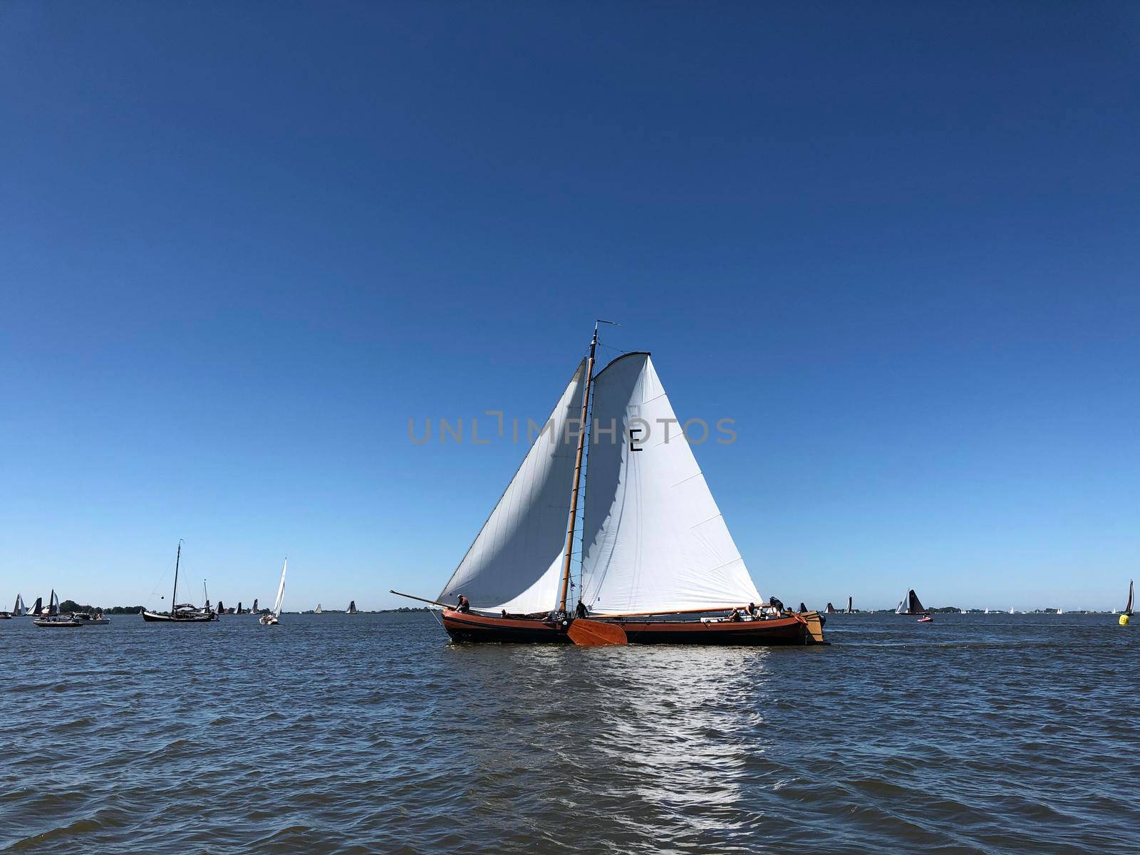 Sailing on a lake in Friesland The Netherlands by traveltelly