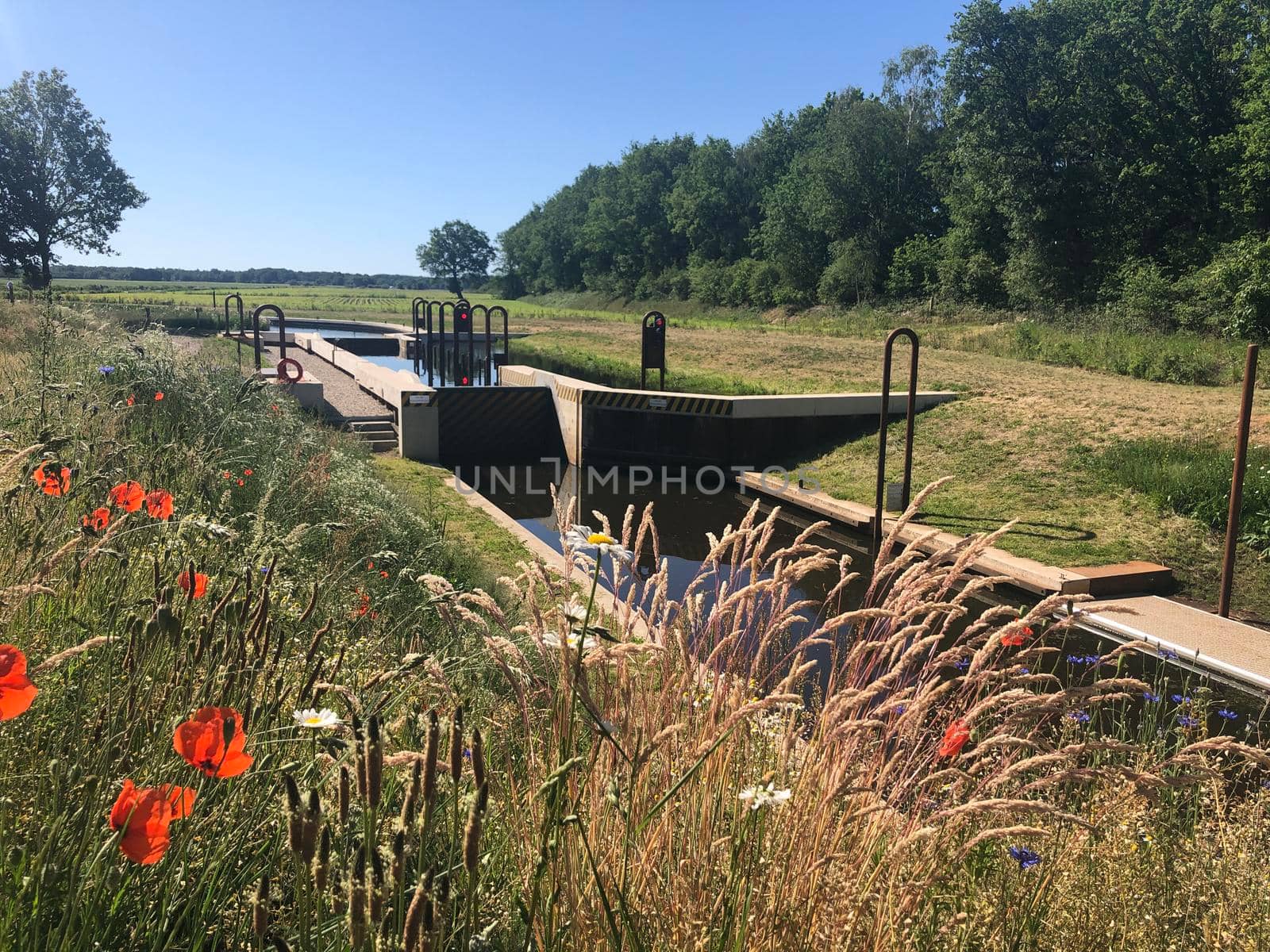 River lock in Junne, Overijssel by traveltelly