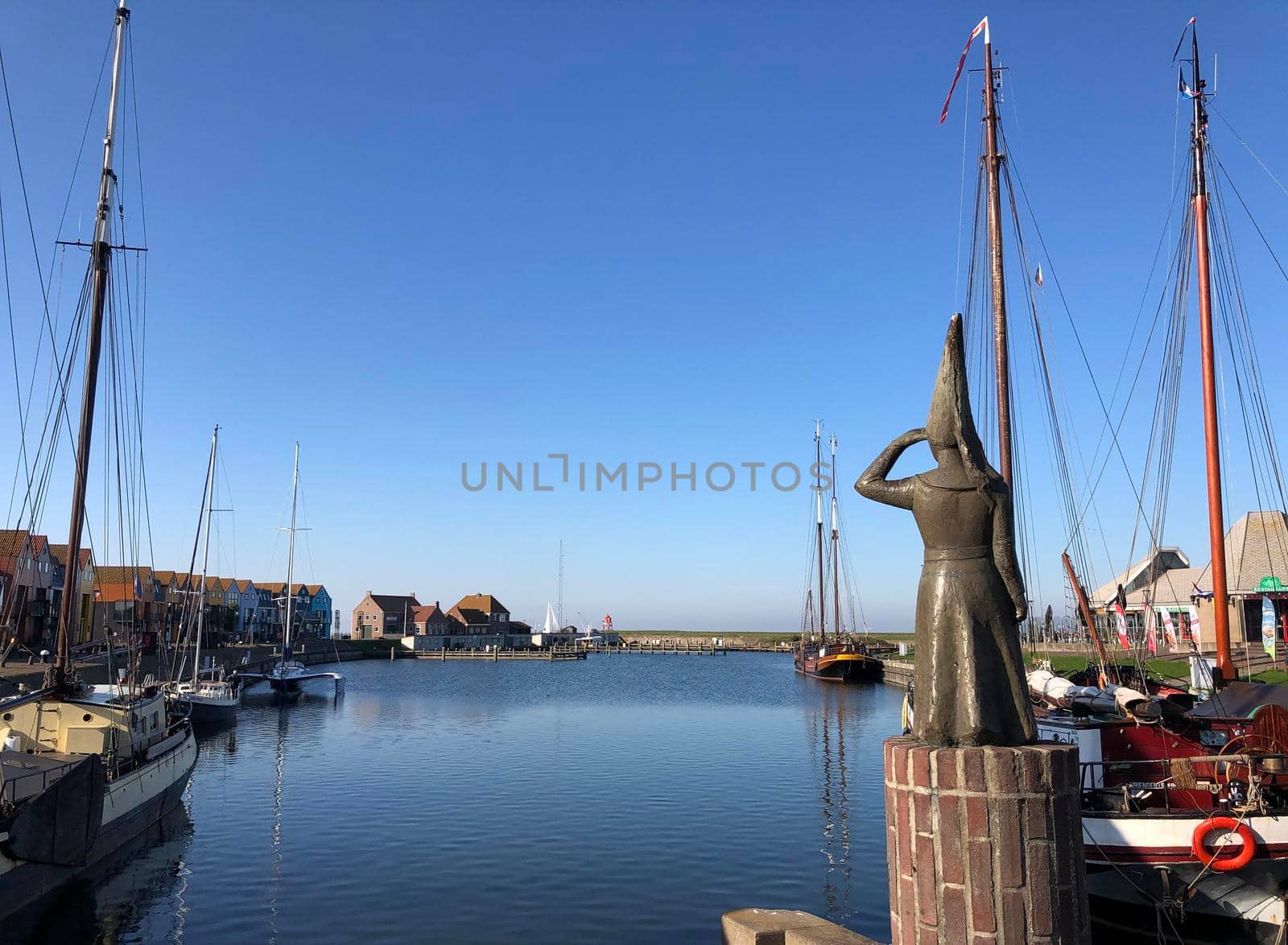 Lady of Stavoren statue in the harbor of Stavoren, Friesland The Netherlands