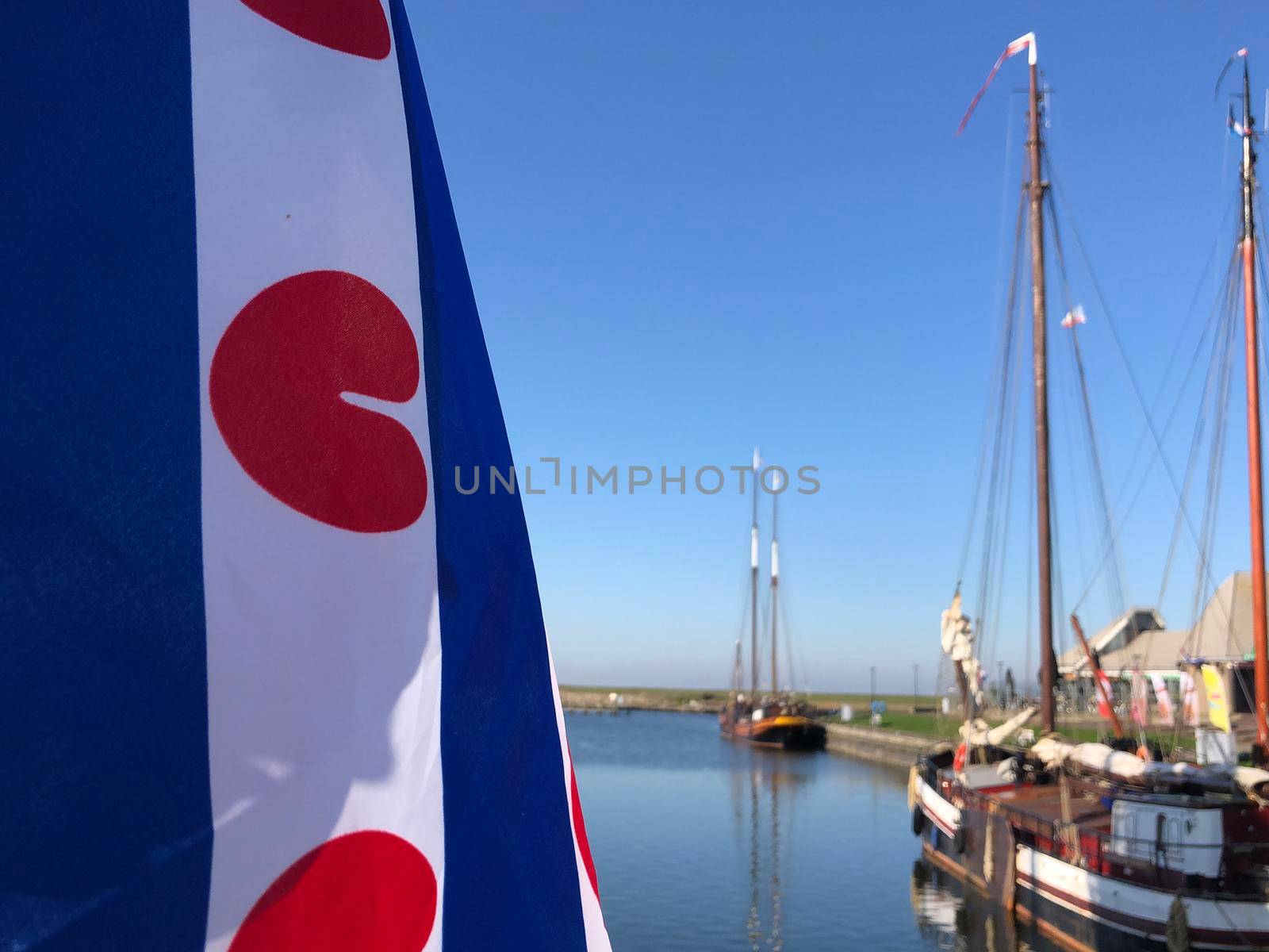 Frisian flag in the harbor of Stavoren, Friesland The Netherlands 
