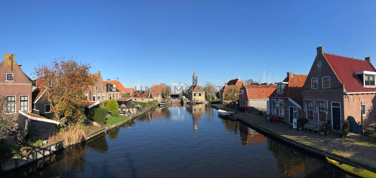 Panorama from a canal in Hindeloopen during autumn in Friesland, The Netherlands