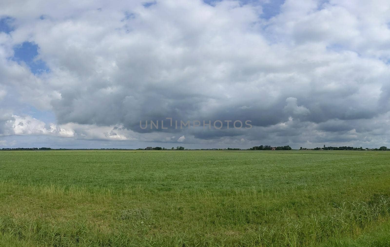 Cloudy Frisian panoramic landscape by traveltelly