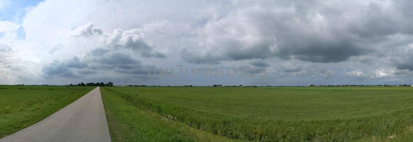 Cloudy Frisian panoramic landscape  by traveltelly