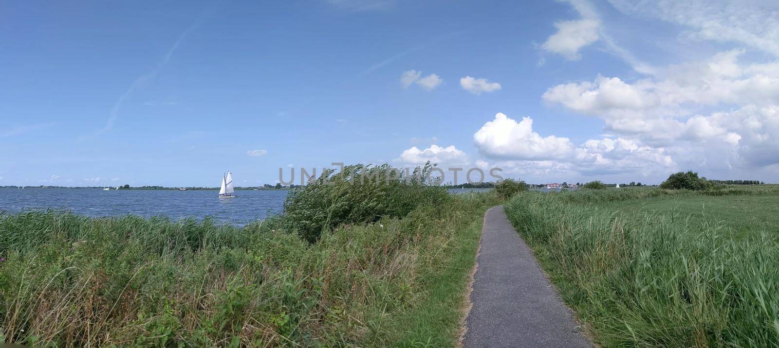 Sailing on a lake in Friesland  by traveltelly