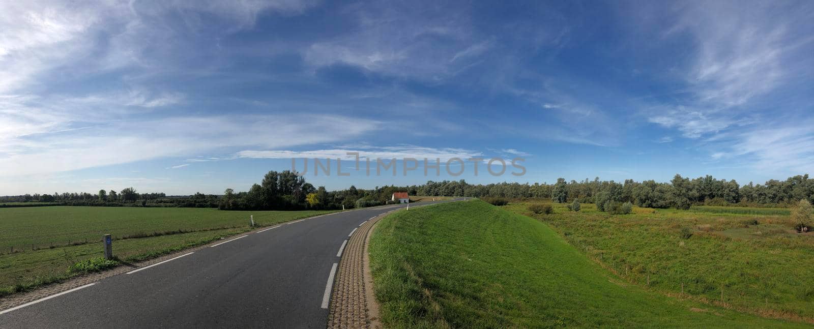 Road on a dyke around Kekerdom  by traveltelly