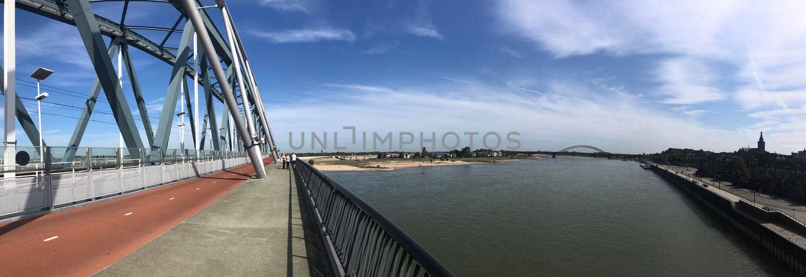 The railway bridge over the Waal river panorama in Nijmegen, Gelderland The Netherlands