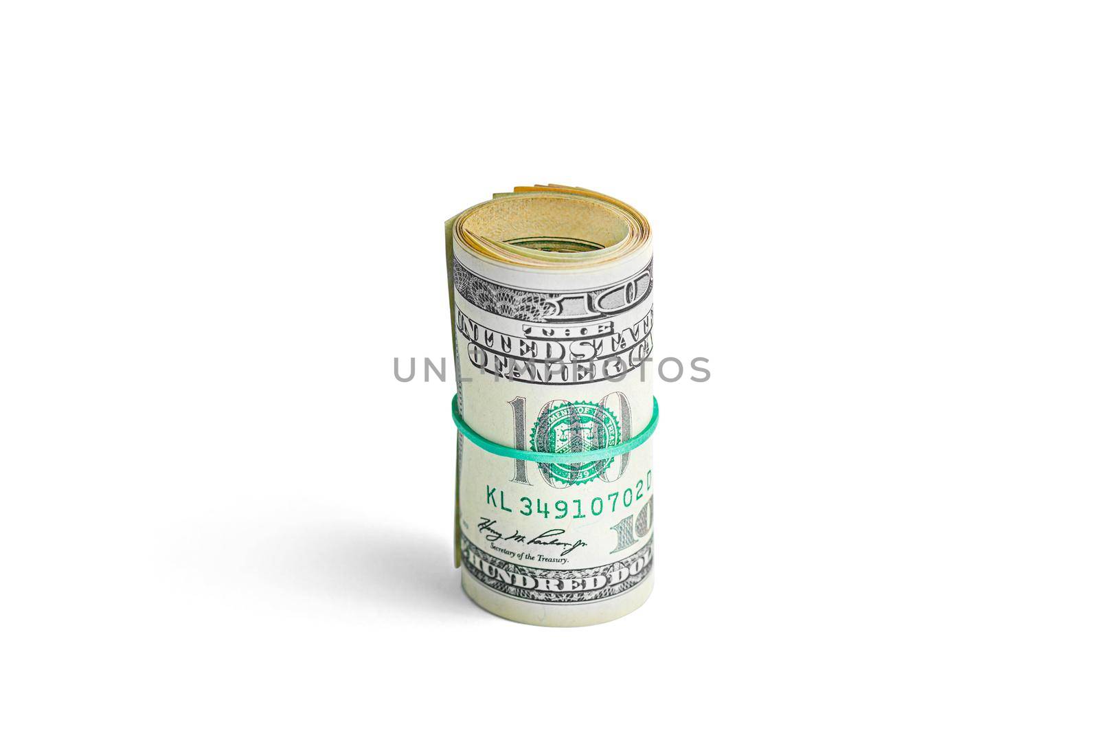 Money on a roll tied with an elastic band. The isolated object on a white background with a shadow. Close up photo of money. U.S. dollars. Banknotes. Paper money isolated on white background.