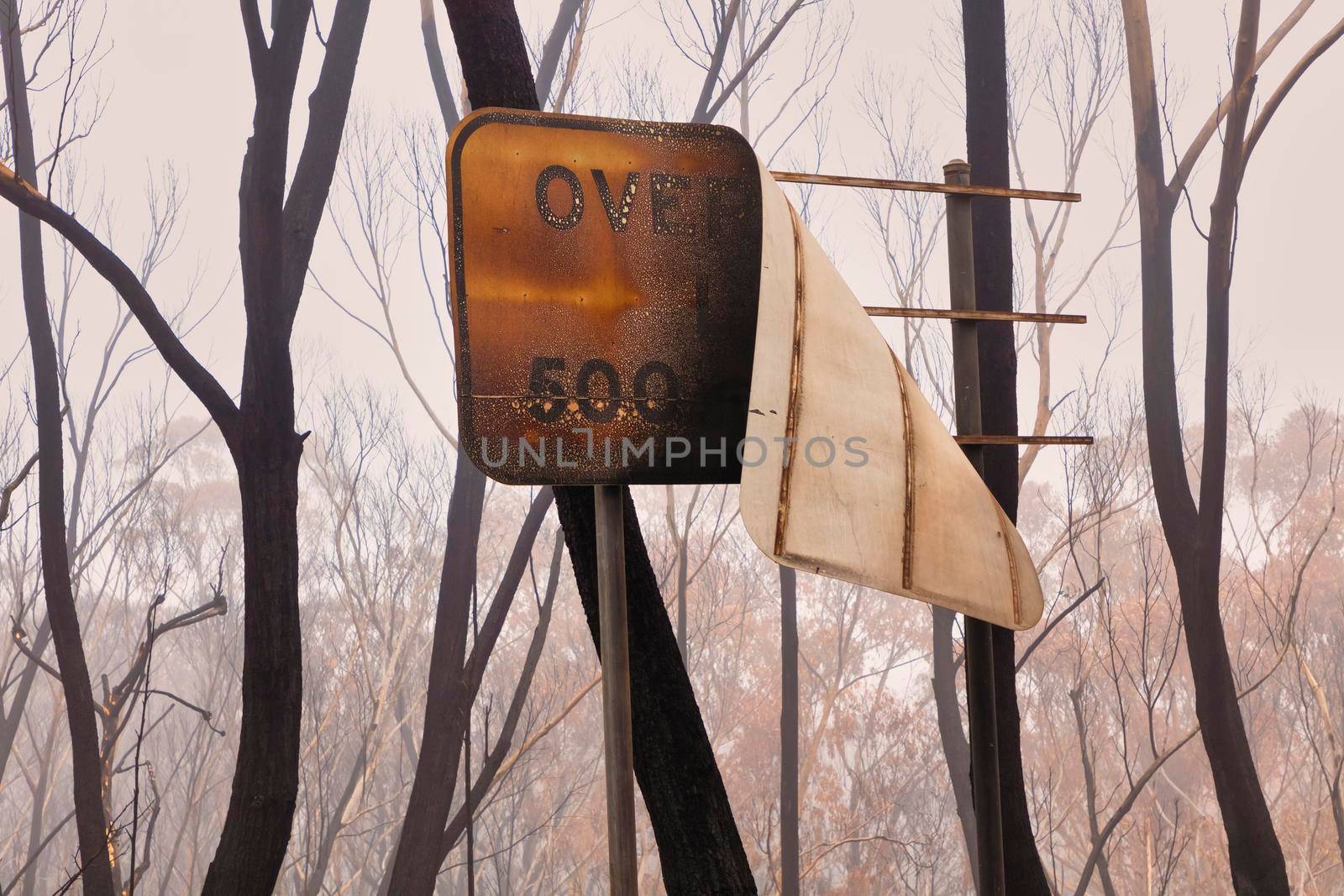 A street sign burnt by bushfire in The Blue Mountains in Australia