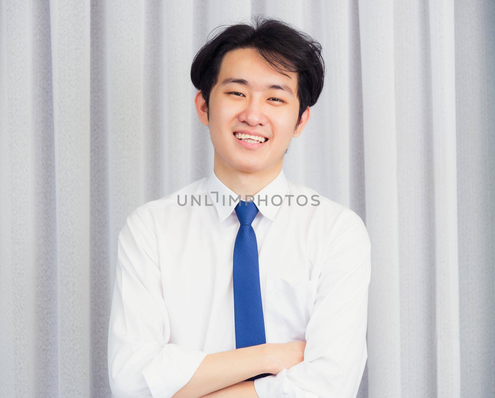 Business handsome man wearing shirt pose point finger to side by Sorapop