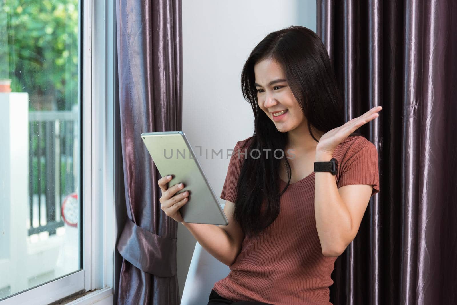 Businesswoman video conference  by digital tablet she touching on screen by Sorapop