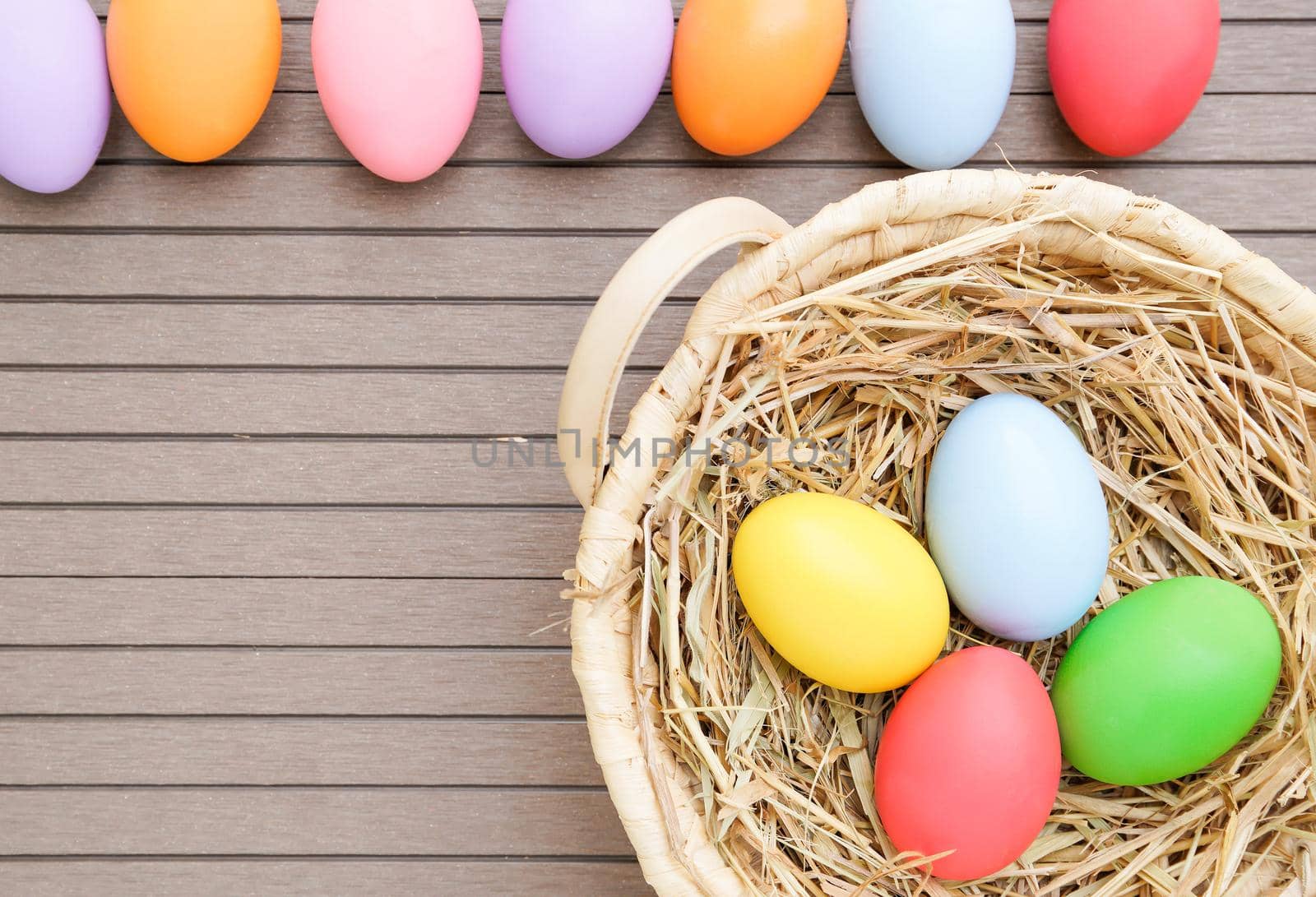 close up Easter eggs in the basket on wood by stoonn