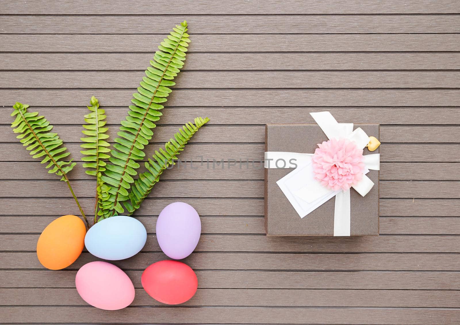 Easter eggs in the basket and gift box by stoonn