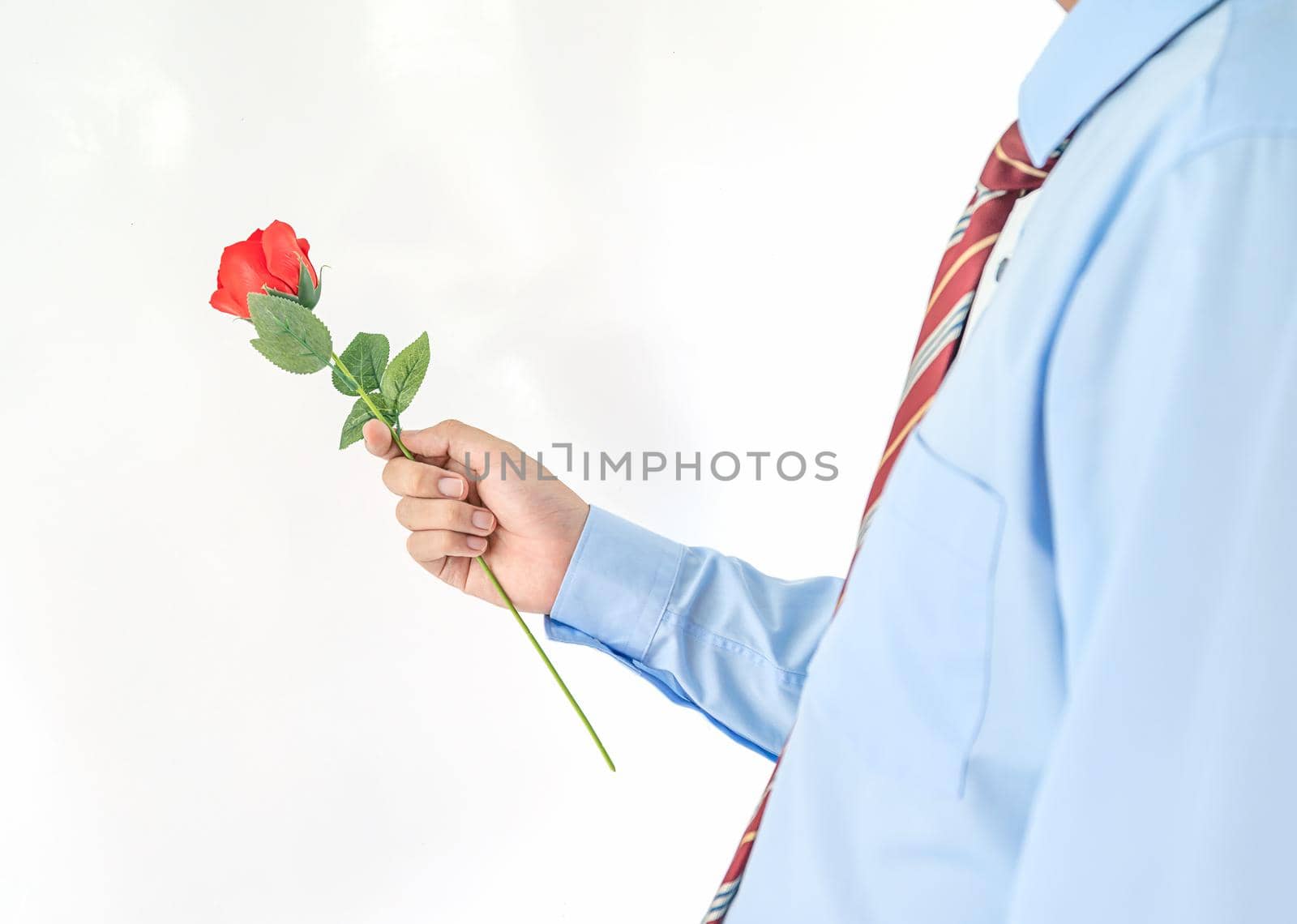 Man holding with red rose on white background by stoonn