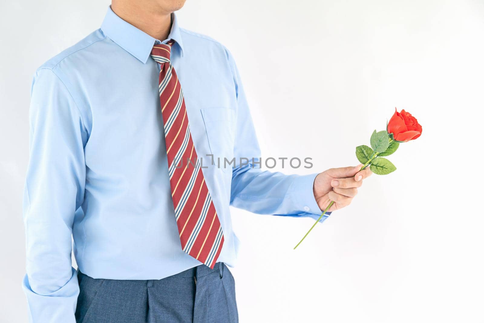 Close up photo of man holding with red rose on white background