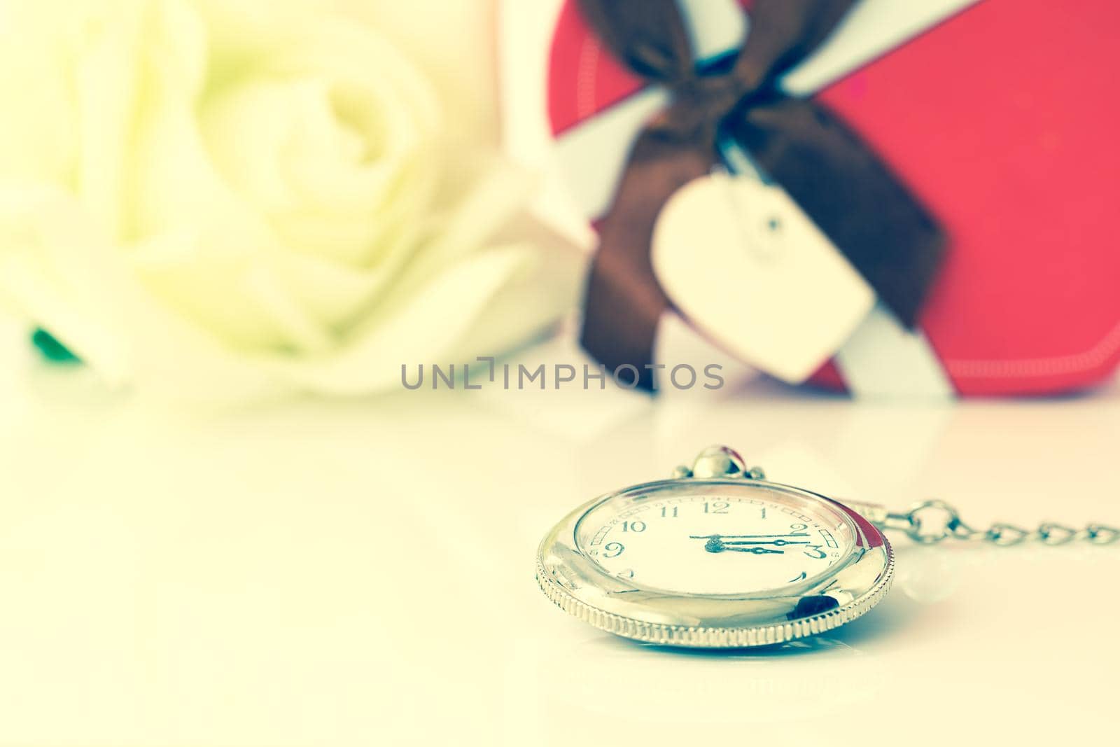 White rose and heart-shaped box on white background, Valentine'sDay concept