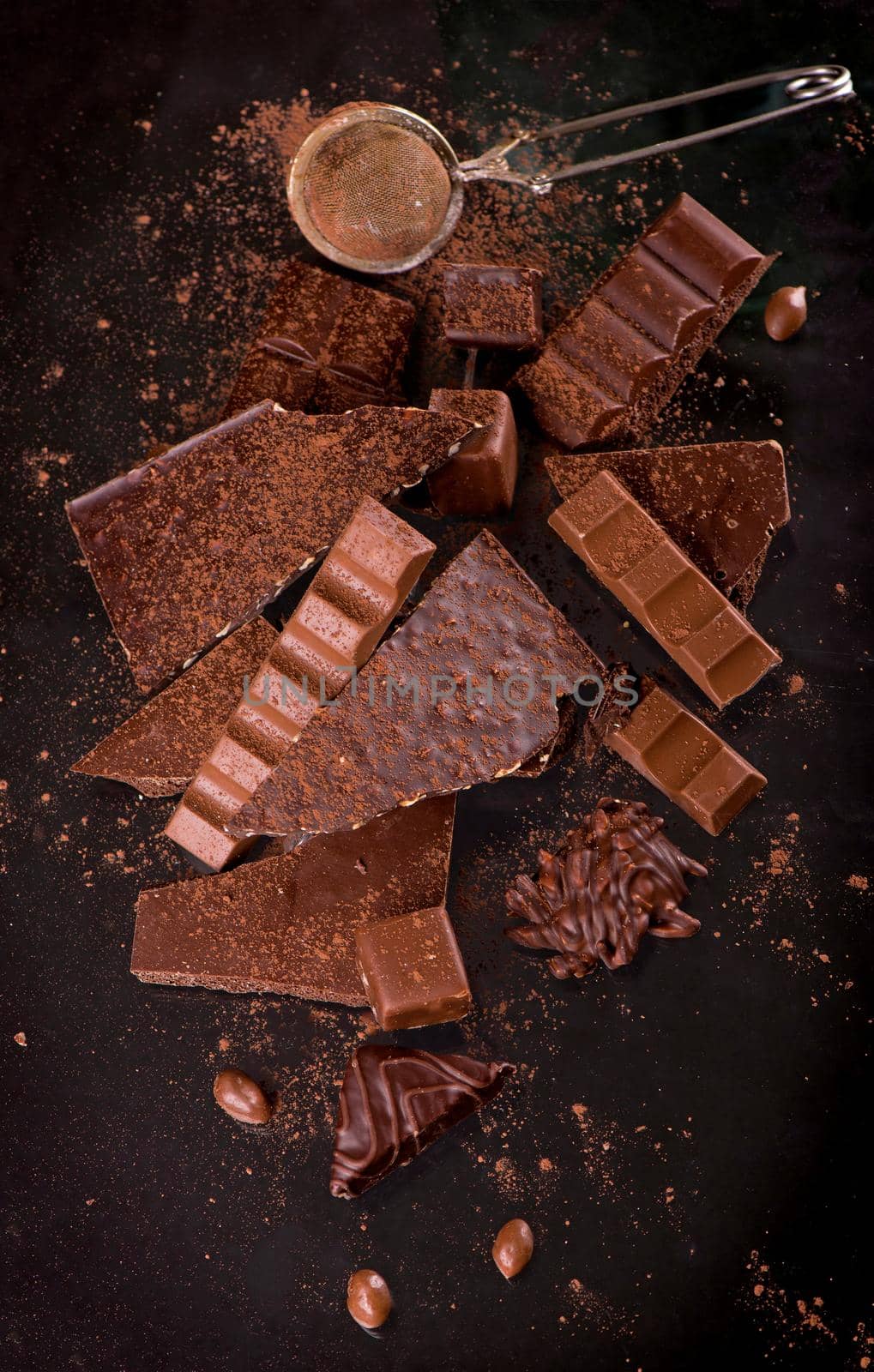 dark chocolate over wooden background, selective focus.