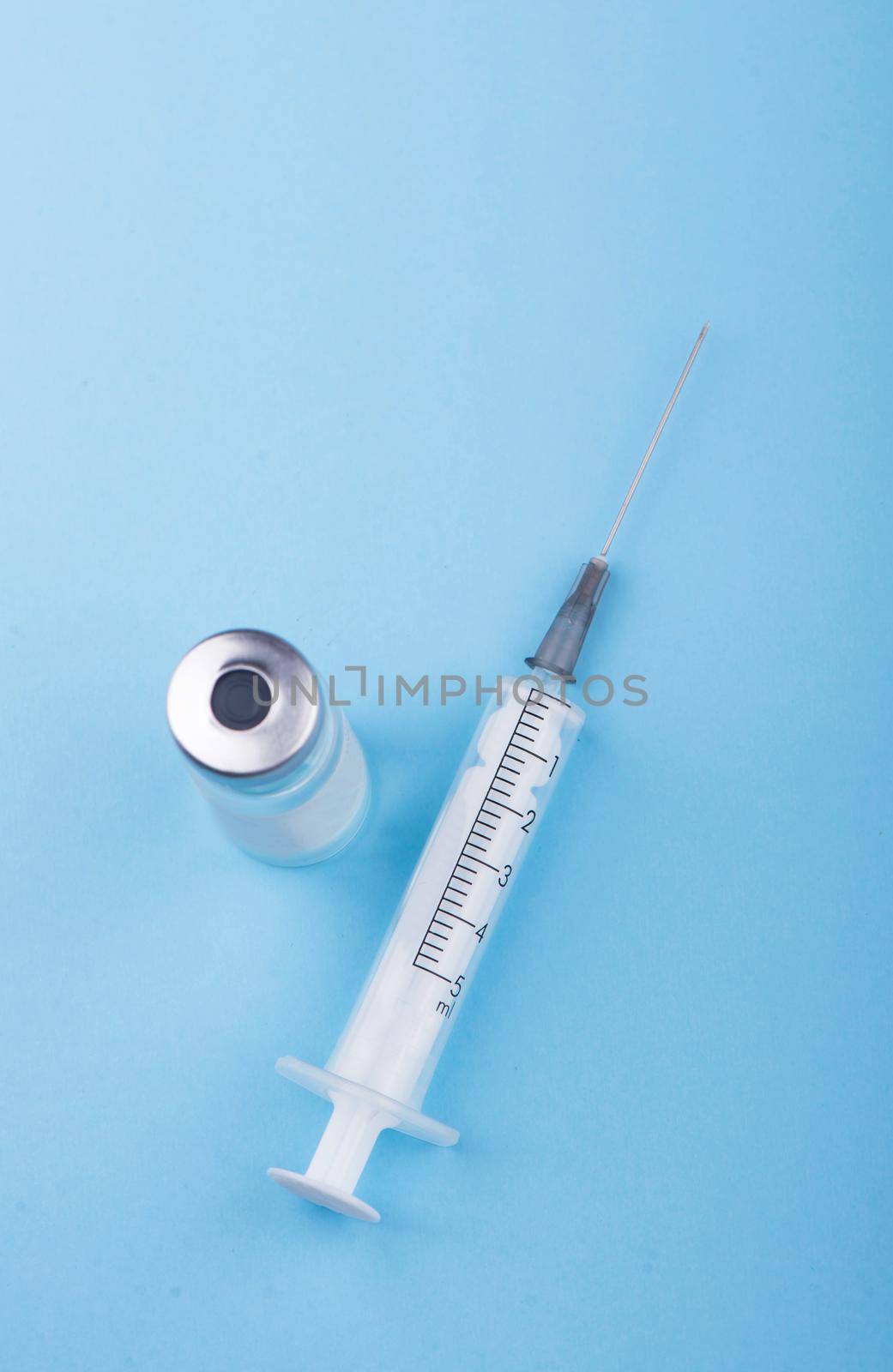 syringe on the table, medical supplies are on the table by aprilphoto