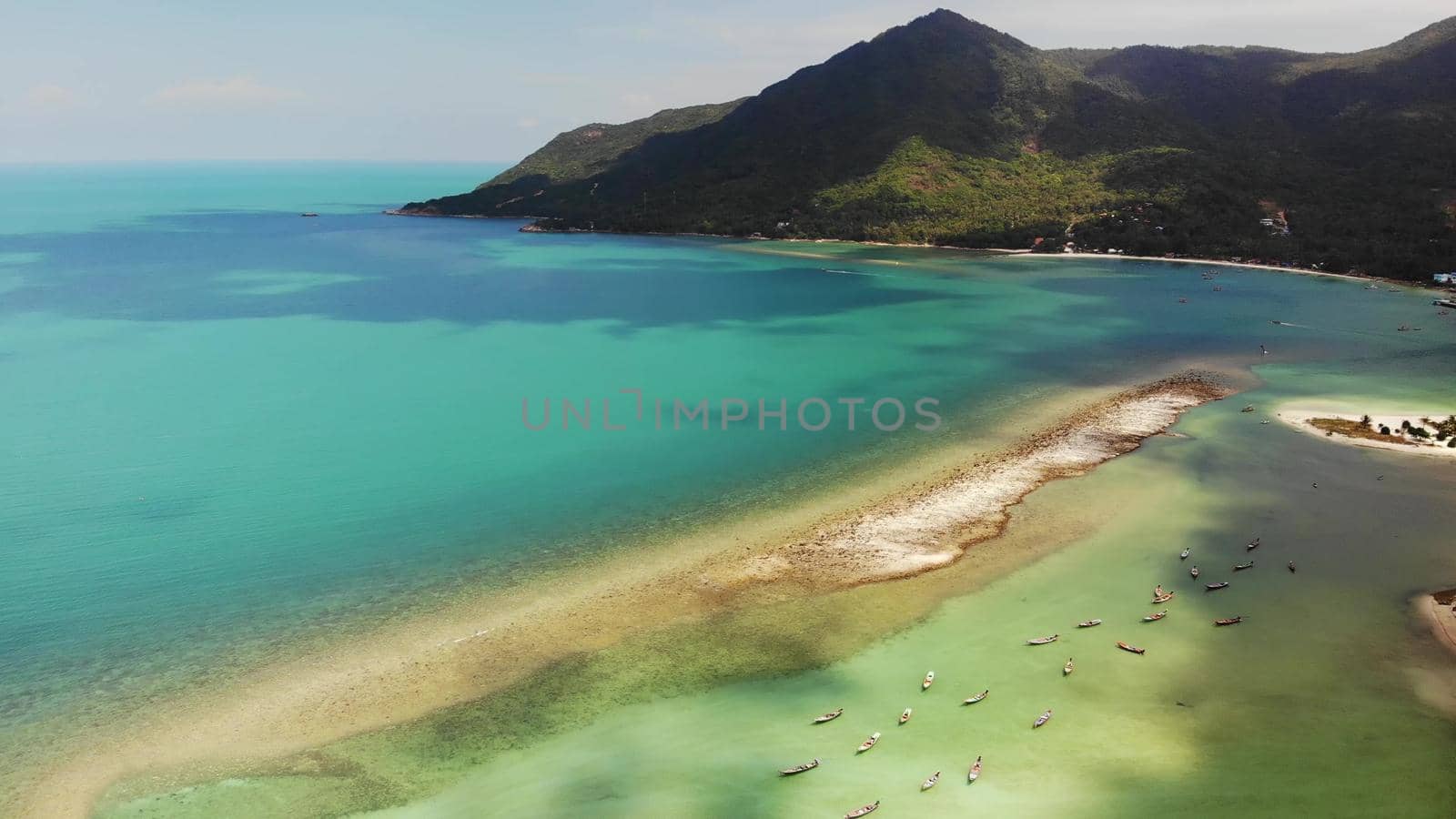 Aerial drone view island Koh Phangan Thailand. Exotic coast panoramic landscape, Chaloklum Malibu fisherman beach, summer day. Sandy path, corals. Vivid seascape, mountain coconut palms from above