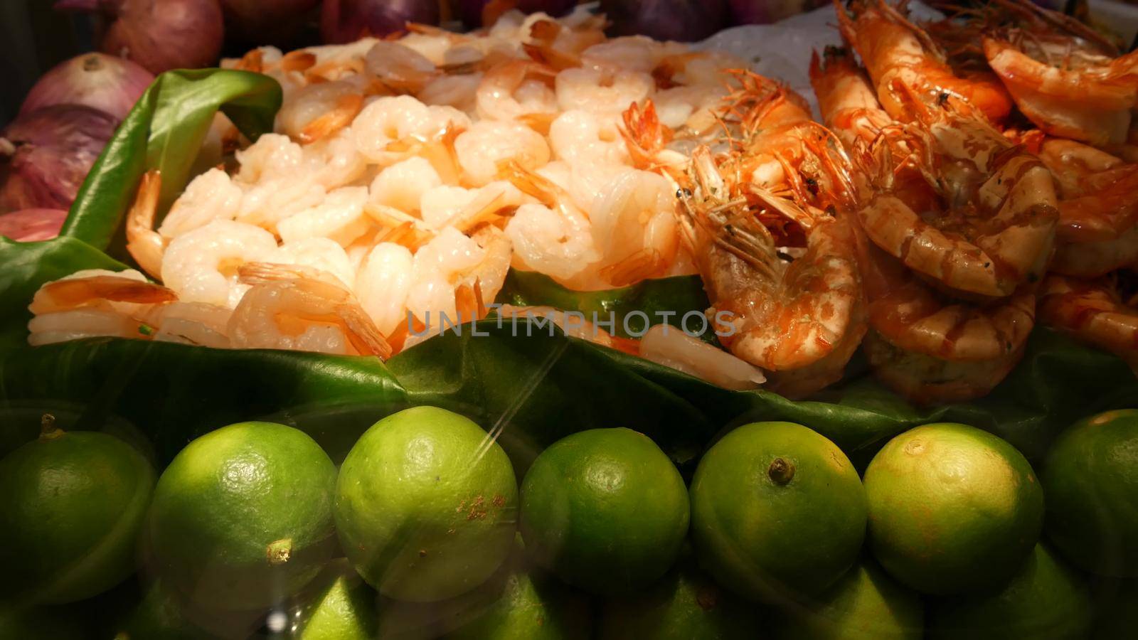National Asian Exotic ready to eat seafood at night street market food court in Thailand. Delicious Grilled Prawns or Shrimps and other snacks