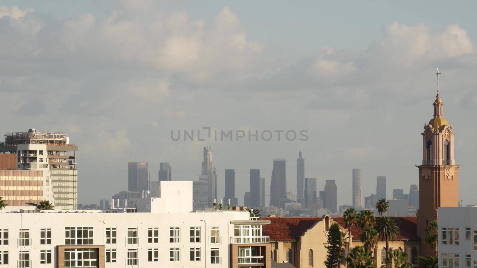 Highrise skyscrapers of metropolis in smog, Los Angeles, California USA. Air toxic pollution and misty urban downtown skyline. Cityscape in dirty fog. Low visibility in city with ecology problems by DogoraSun