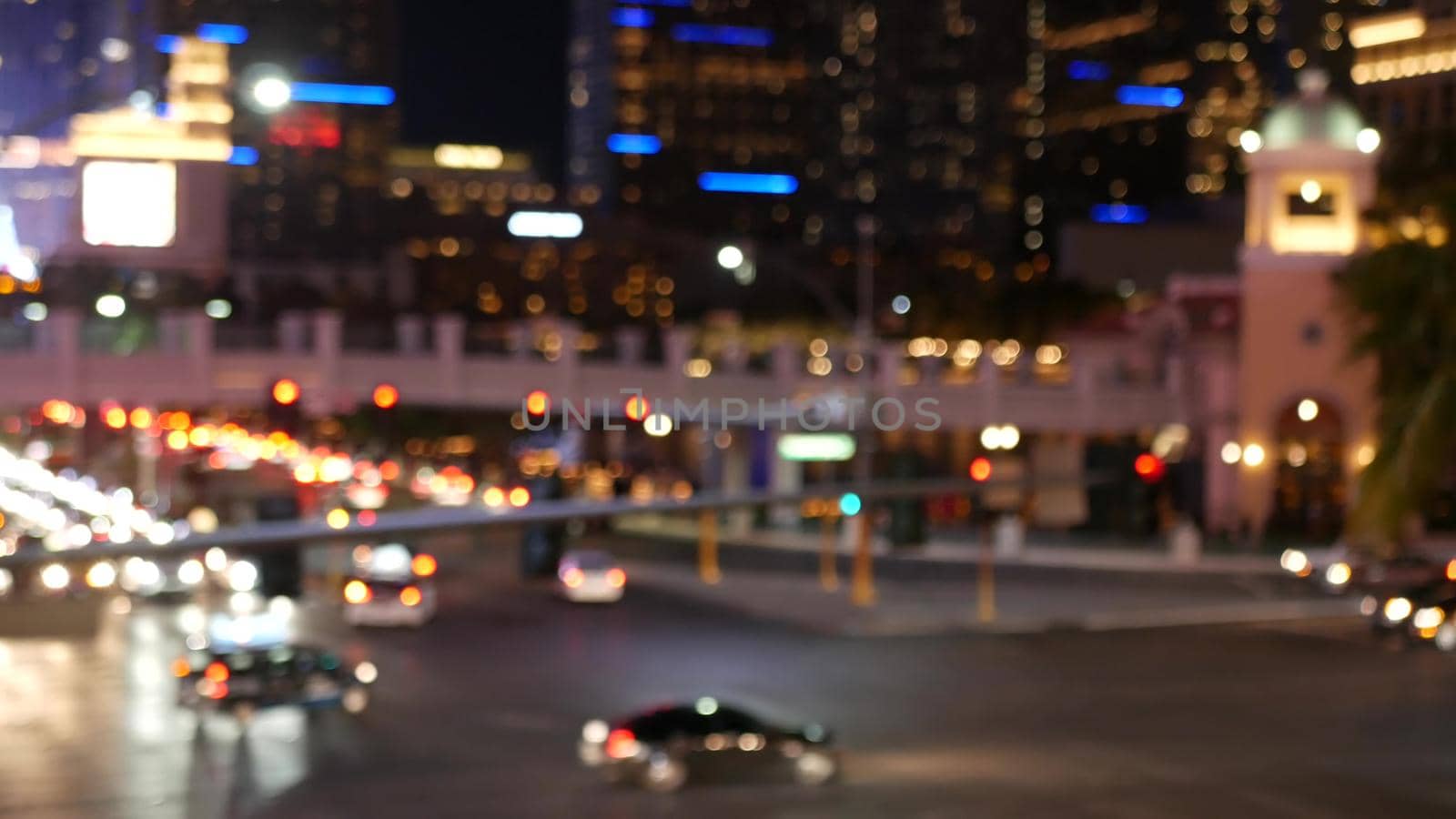 Defocused fabulous Las Vegas Strip boulevard, luxury casino and hotel, gambling area in Nevada, USA. Nightlife and traffic near Fremont street in tourist money playing resort. Neon lights of sin city.