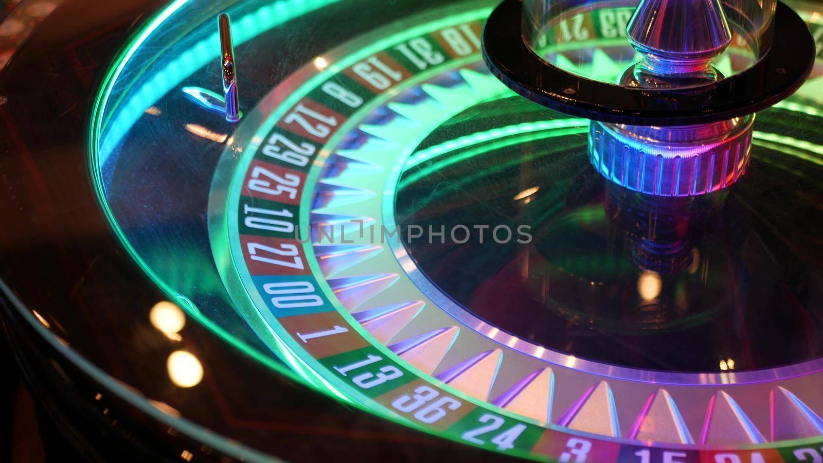 French style roulette table for money playing in Las Vegas, USA. Spinning wheel with black and red sectors for risk game of chance. Hazard amusement with random algorithm, gambling and betting symbol.