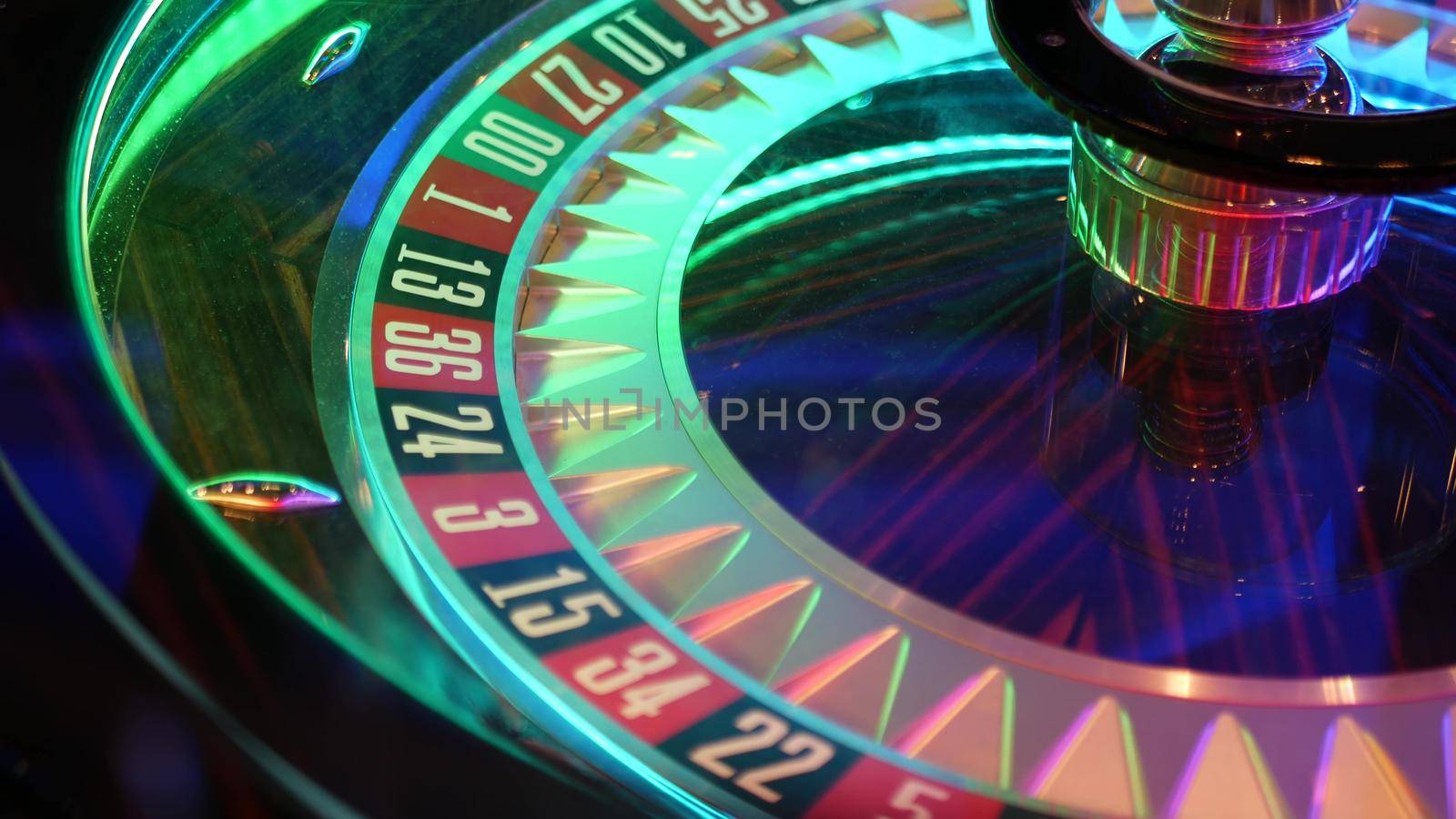 French style roulette table for money playing in Las Vegas, USA. Spinning wheel with black and red sectors for risk game of chance. Hazard amusement with random algorithm, gambling and betting symbol.