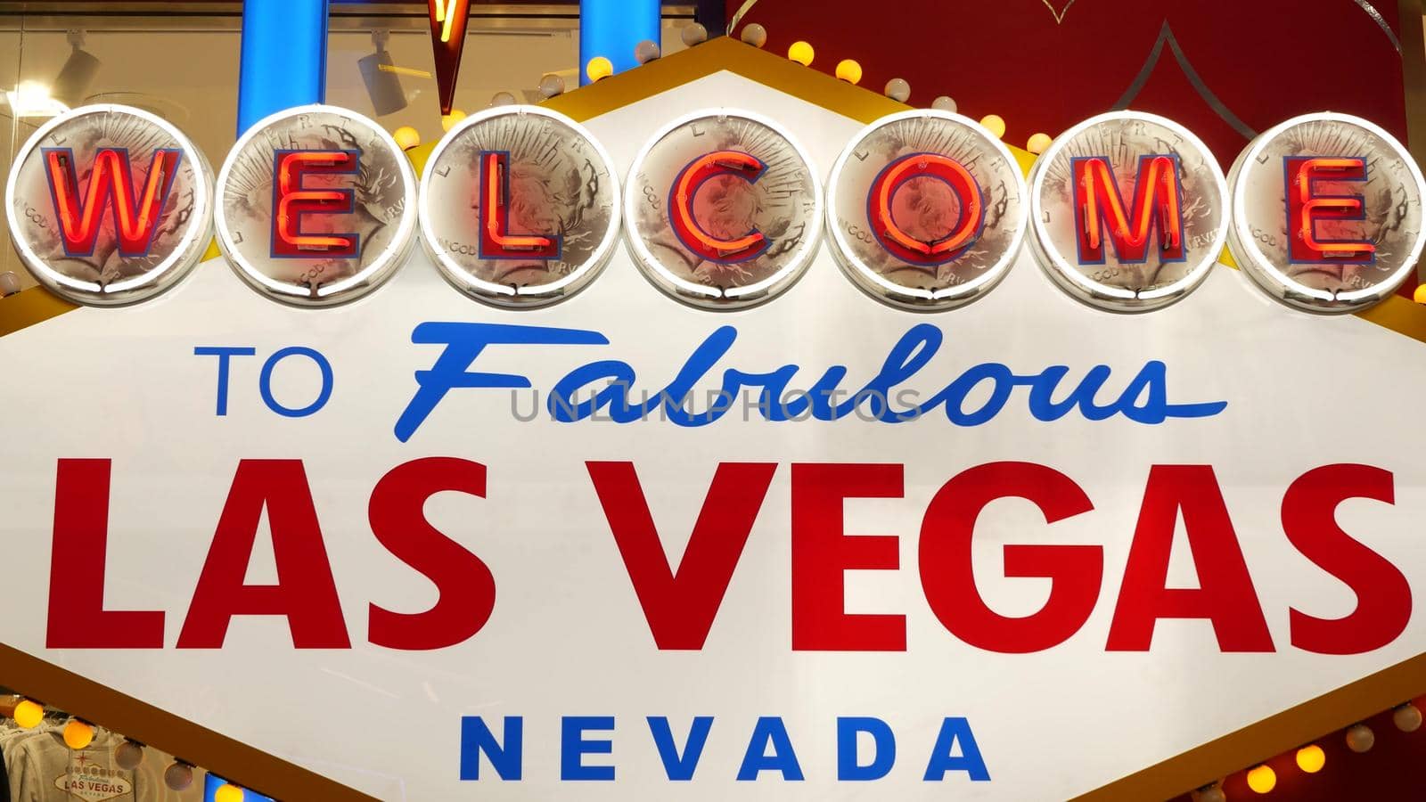 Welcome to fabulous Las Vegas retro neon sign in gambling tourist resort, USA. Iconic vintage glowing banner, symbol of casino, games of chance, money playing and hazard bets. Illuminated signboard.