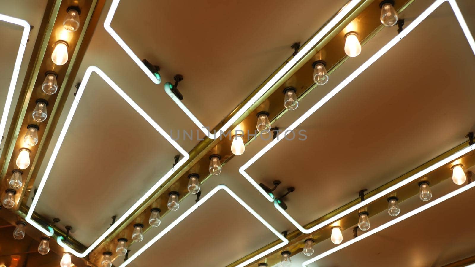 Old fasioned electric lamps blinking and glowing at night. Abstract close up of retro casino decoration shimmering in Las Vegas, USA. Illuminated vintage style bulbs glittering on Freemont street.