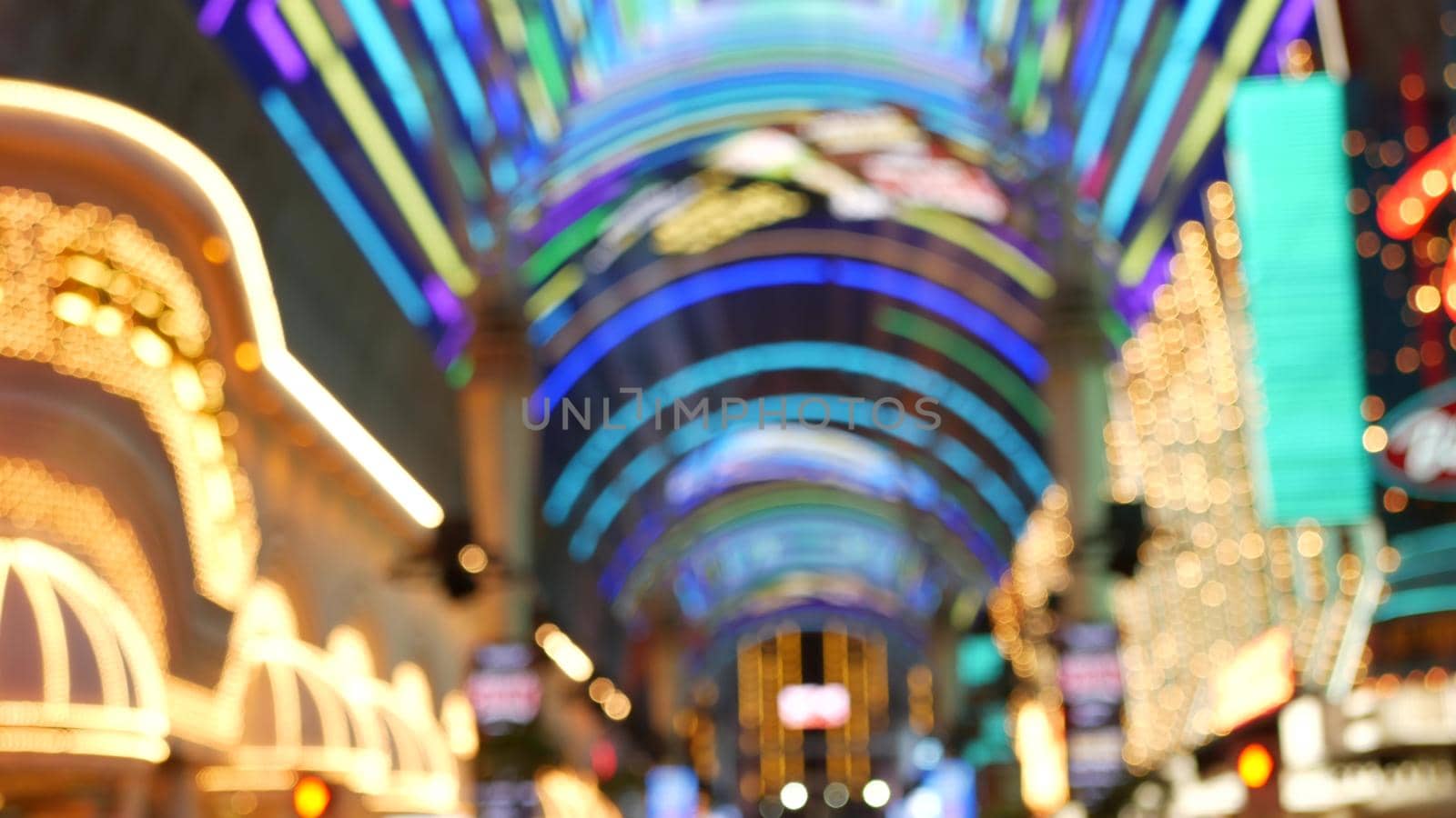 Defocused old fasioned electric lamps glowing at night. Abstract close up of blurred retro casino decoration shimmering, Las Vegas USA. Illuminated vintage style bulbs glittering on Freemont street.