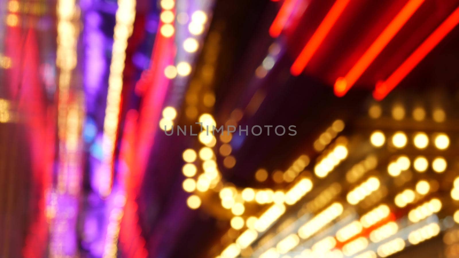 Defocused old fasioned electric lamps glowing at night. Abstract close up of blurred retro casino decoration shimmering, Las Vegas USA. Illuminated vintage style bulbs glittering on Freemont street.