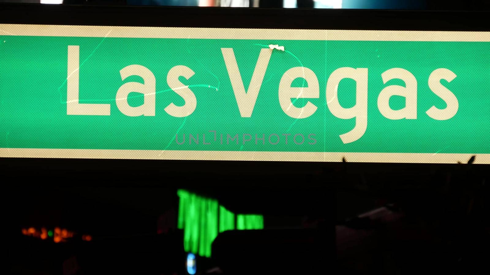 Fabulos Las Vegas, traffic sign glowing on The Strip in sin city of USA. Iconic signboard on the road to Fremont street in Nevada. Illuminated symbol of casino money playing and bets in gaming area.