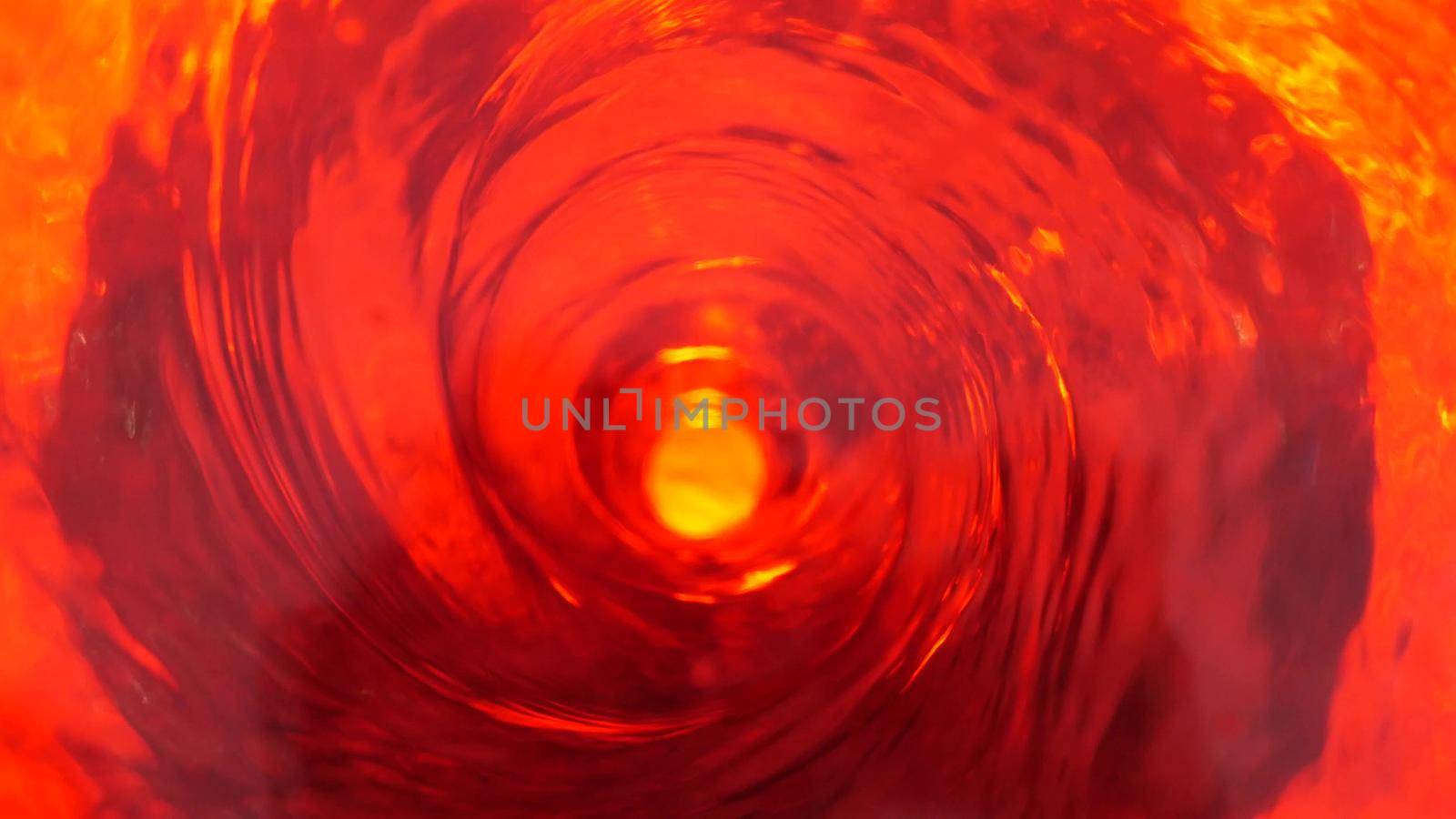 Symbol of hell, inferno and infinity. Red liquid hypnotic looped aqua swirl turning. Meditative luminous whirlpool. Mesmerising spiral tunnel of crystal fluid. Fiery surreal rhythmic water gradient.