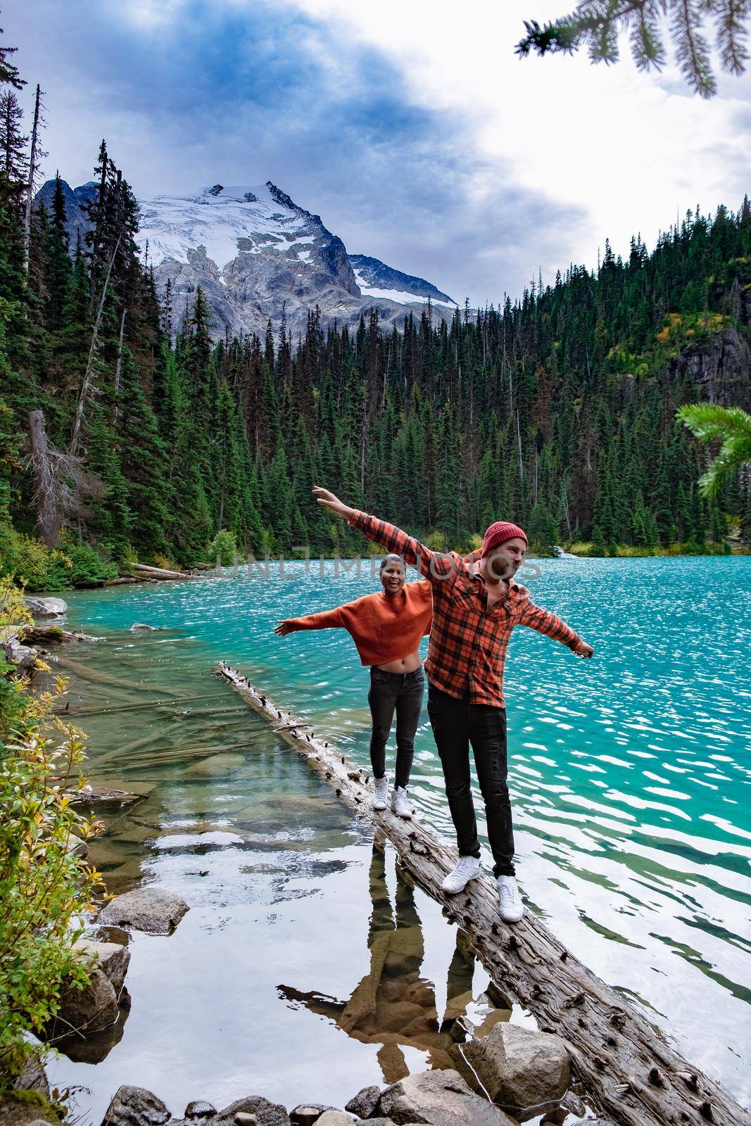 Majestic mountain lake in Canada. Upper Joffre Lake Trail View, couple visit Joffre Lakes Provincial Park - Middle Lake by fokkebok