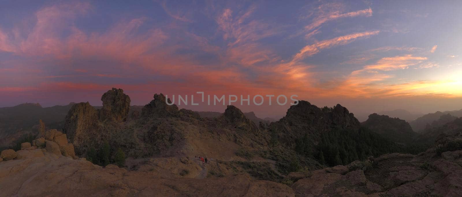 Sunset and pink sky panorama of Roque Nublo the volcanic rock on the island of Gran Canaria