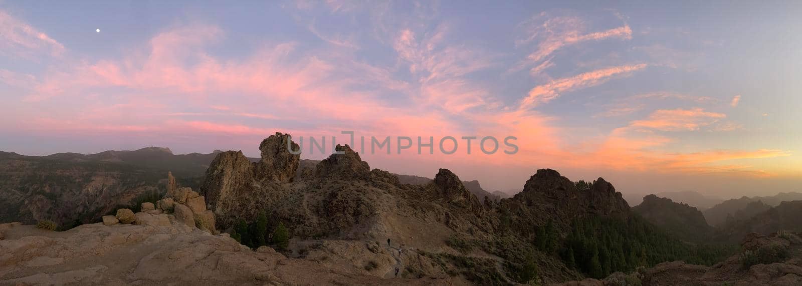 Sunset and pink sky panorama at Roque Nublo the volcanic rock on the island of Gran Canaria