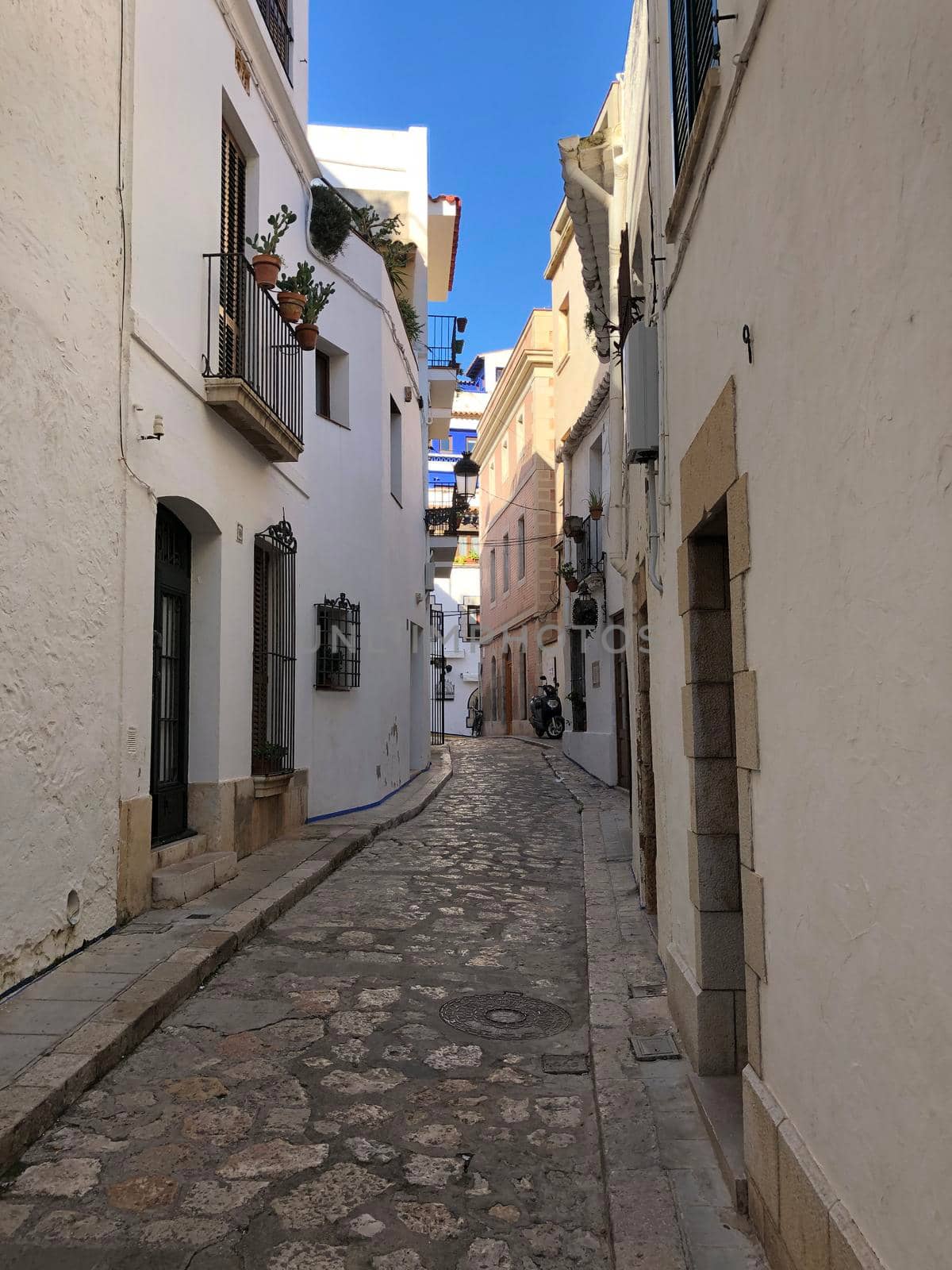 Street in Sitges, Spain by traveltelly