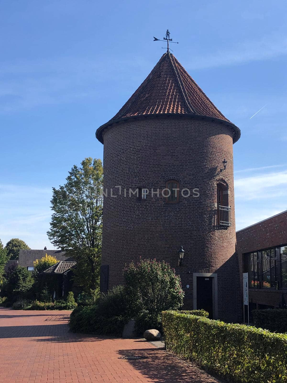 Historic city tower in Isselburg, Germany by traveltelly