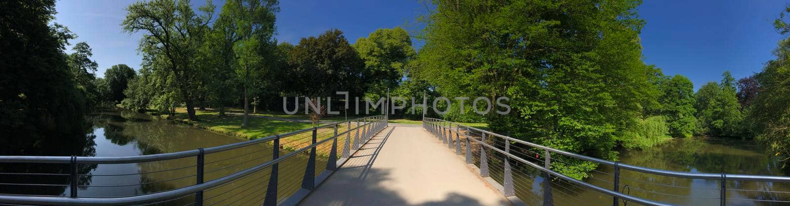 Panorama from a bridge over a river in the Bürger Park in Braunschweig, Germany